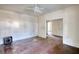 Empty bedroom featuring hardwood floors, white trim, and a ceiling fan at 2228 Emory St, Covington, GA 30014