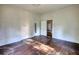 Bedroom with hardwood floors, two doors, and natural light at 2228 Emory St, Covington, GA 30014