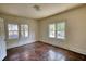 Bedroom with windows that provide natural light and hardwood floors at 2228 Emory St, Covington, GA 30014