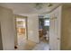 Hallway showing access to the kitchen and bathroom featuring linoleum flooring and cream-colored walls at 2228 Emory St, Covington, GA 30014