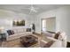 Living room with staged furniture over hardwood floors at 2228 Emory St, Covington, GA 30014