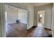 Living space featuring hardwood floors and doorways leading to other rooms at 2228 Emory St, Covington, GA 30014
