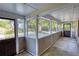 Covered porch overlooking lush yard with mature trees, offering an outdoor living space at 2228 Emory St, Covington, GA 30014