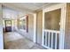 Covered porch with vintage screen doors and red window shutters, offering outdoor living space at 2228 Emory St, Covington, GA 30014