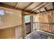Sunroom featuring traditional wood-and-bamboo blinds, capturing natural light with rustic charm at 2228 Emory St, Covington, GA 30014