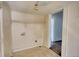 An empty, unfinished room with linoleum flooring and a doorway leading to another room at 2228 Emory St, Covington, GA 30014