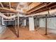 Unfinished basement showing utilities and wooden support beams offering potential for customization and expansion at 2406 Tilson Rd, Decatur, GA 30032