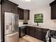 Modern kitchen with stainless steel appliances and sleek dark cabinets at 2406 Tilson Rd, Decatur, GA 30032