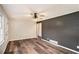 Open living room with hardwood floors, lots of natural light, and a paneled accent wall at 2406 Tilson Rd, Decatur, GA 30032