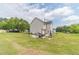 Large backyard with a patio seating area, perfect for outdoor entertaining at 4023 Port Springs Trl, Snellville, GA 30039