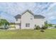 Rear view of the home showcasing a spacious yard and well-kept exterior at 4023 Port Springs Trl, Snellville, GA 30039