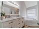 Bright bathroom has double vanity, soaking tub, and sleek fixtures at 4023 Port Springs Trl, Snellville, GA 30039