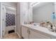 Well-lit bathroom with updated vanity, mirror, and fixtures and a separate toilet and shower at 4023 Port Springs Trl, Snellville, GA 30039