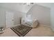 Bright bedroom with a vaulted ceiling, plush carpeting and a gorgeous upholstered bed at 4023 Port Springs Trl, Snellville, GA 30039