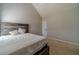 Bedroom featuring neutral walls, plush carpeting and a bed frame and headboard made of reclaimed wood at 4023 Port Springs Trl, Snellville, GA 30039