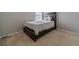 Simple bedroom featuring carpet and a rustic wood-framed bed, perfect for relaxation at 4023 Port Springs Trl, Snellville, GA 30039