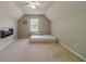 Spacious bonus room featuring a minimalist design, vaulted ceiling and sleek electric fireplace at 4023 Port Springs Trl, Snellville, GA 30039