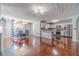 Open-concept kitchen and dining area with modern appliances and hardwood floors at 4023 Port Springs Trl, Snellville, GA 30039