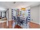 Well-lit dining area, decorated with balloons, creating a celebratory atmosphere with hardwood floors at 4023 Port Springs Trl, Snellville, GA 30039
