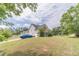 Charming home with a manicured lawn, driveway, and attached garage at 4023 Port Springs Trl, Snellville, GA 30039