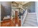 Grand two-story foyer with hardwood floors, staircase, and elegant decorative details at 4023 Port Springs Trl, Snellville, GA 30039