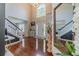 Bright, two-story foyer with hardwood floors, large arched window and decorative floral accents at 4023 Port Springs Trl, Snellville, GA 30039