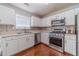 Well-equipped kitchen with stainless steel appliances, white cabinetry, and a sleek, functional design at 4023 Port Springs Trl, Snellville, GA 30039