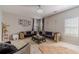 Elegant living room with modern furnishings, plush rugs and a stylish chandelier at 4023 Port Springs Trl, Snellville, GA 30039