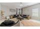 Elegant living room with modern furnishings, plush rugs and a stylish chandelier at 4023 Port Springs Trl, Snellville, GA 30039