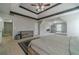 Spacious main bedroom with tray ceilings, carpet, and ensuite bathroom access at 4023 Port Springs Trl, Snellville, GA 30039