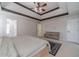 Large bedroom featuring a tray ceiling, modern dresser, and adjoining bathroom at 4023 Port Springs Trl, Snellville, GA 30039