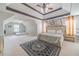 Large main bedroom featuring tray ceilings, ample space, and stylish decor at 4023 Port Springs Trl, Snellville, GA 30039