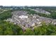 Aerial view of 6807 Prelude Dr showcasing the neighborhood surrounded by trees and greenery at 6807 Prelude Dr, Atlanta, GA 30328