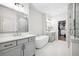 A primary bathroom features double sinks, a soaking tub, and a glass enclosed shower with marble tiling at 6807 Prelude Dr, Atlanta, GA 30328