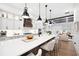 Spacious kitchen with island seating, modern lighting, and stainless steel appliances at 6807 Prelude Dr, Atlanta, GA 30328