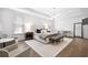 A spacious bedroom boasts hardwood floors, an area rug, and a tray ceiling with designer lighting at 6807 Prelude Dr, Atlanta, GA 30328