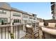 Private deck features comfortable seating and overlooks a row of modern townhomes at 6807 Prelude Dr, Atlanta, GA 30328