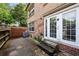 Brick patio and wall with white double doors on a brick house at 6980 Roswell Road # A8, Atlanta, GA 30328