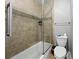 Well-maintained bathroom featuring tiled shower/tub, neutral decor, and functional design at 6980 Roswell Road # A8, Atlanta, GA 30328