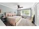 Comfortable bedroom with a plush carpet, stylish decor, and lots of natural light at 6980 Roswell Road # A8, Atlanta, GA 30328