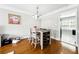 Charming dining area with hardwood floors, modern lighting, and neutral decor at 6980 Roswell Road # A8, Atlanta, GA 30328