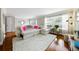 Bright living room featuring a large sectional sofa, wood floors, and lots of natural light at 6980 Roswell Road # A8, Atlanta, GA 30328