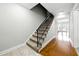 Staircase with black railing and natural light at 6980 Roswell Road # A8, Atlanta, GA 30328