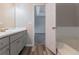 Well-lit bathroom with a glimpse into the bedroom showing seamless flow and accessibility at 12241 Cypress Way, Fayetteville, GA 30215