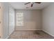 Neutral bedroom featuring neutral walls, plush carpeting, and a bright window, creating a serene space at 12241 Cypress Way, Fayetteville, GA 30215