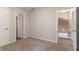 Bedroom with two doorways and neutral walls, creating a simple space at 12241 Cypress Way, Fayetteville, GA 30215