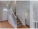 Entryway featuring hardwood floors, a staircase, and an arched doorway at 12241 Cypress Way, Fayetteville, GA 30215