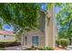 Home exterior featuring a chimney, maintained bushes, and a sliding glass door at 12241 Cypress Way, Fayetteville, GA 30215