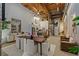Spacious dining room with an open kitchen, spiral staircase, and exposed wooden beams at 170 Boulevard Se # 115E, Atlanta, GA 30312