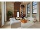 Open-concept living area with contemporary furnishings, large windows, and exposed brick walls at 170 Boulevard Se # 115E, Atlanta, GA 30312